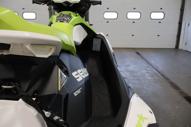 Slide: The Image of 2023 Sea-Doo Spark 3up jet ski in a garage setting. - 24