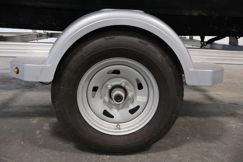 Slide: The Image of Trailer wheel for 2023 Sea-Doo Spark 3up, featuring a sturdy tire and fender. - 25