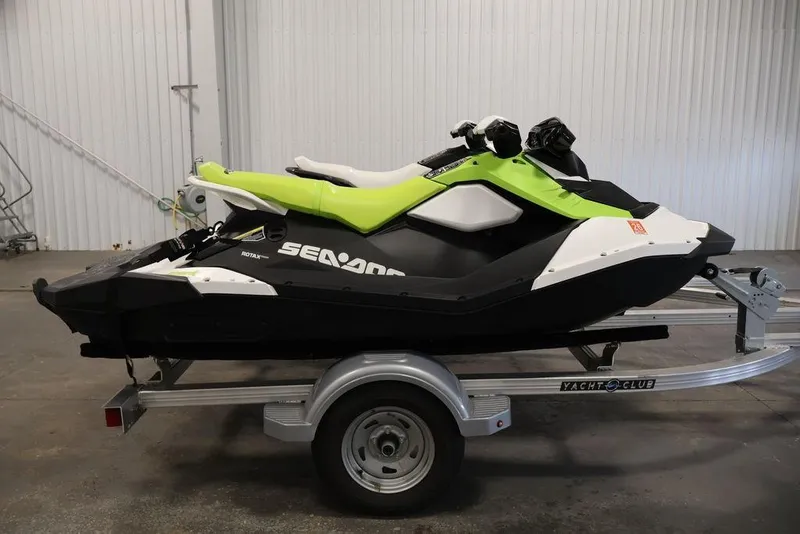 Slide: The Image of 2023 Sea-Doo Spark 3up jet ski on trailer in indoor setting. - 4