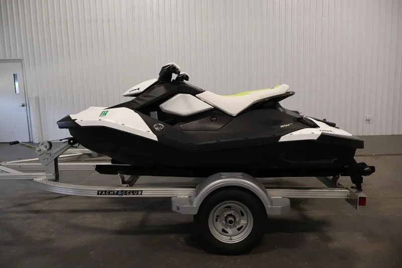Slide: The Image of 2023 Sea-Doo Spark 3up jet ski on trailer in indoor setting. - 7