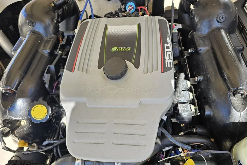 Slide: The Image of Engine of a 2013 Monterey M3 Sport Boat, featuring a MerCruiser 350 MAG. - 100