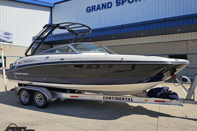 Slide: The Image of 2013 Monterey M3 Sport Boat on trailer outside Grand Sport Center. - 11