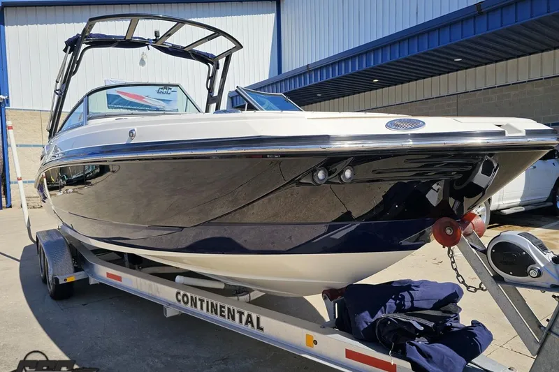 Slide: The Image of 2013 Monterey M3 Sport Boat on trailer, parked outdoors. - 12
