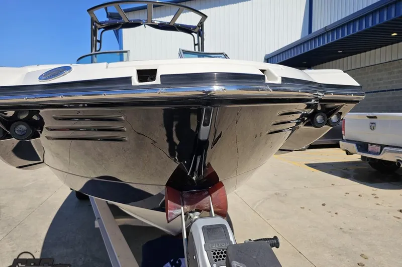 Slide: The Image of 2013 Monterey M3 Sport Boat on trailer, parked outdoors near a building. - 14