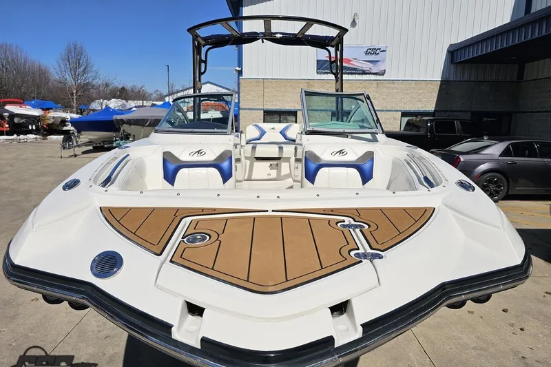 Slide: The Image of 2013 Monterey M3 Sport Boat with sleek design, docked outdoors. - 15