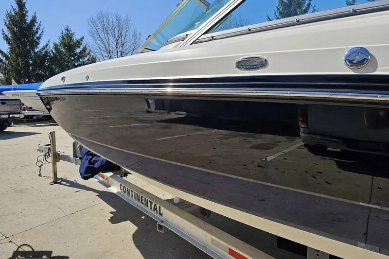 Slide: The Image of 2013 Monterey M3 Sport Boat on trailer, parked outdoors. - 22