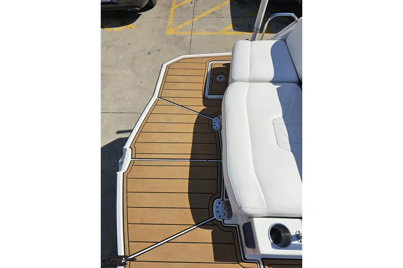 Slide: The Image of 2013 Monterey M3 Sport Boat deck with white seating and wood-style flooring. - 34