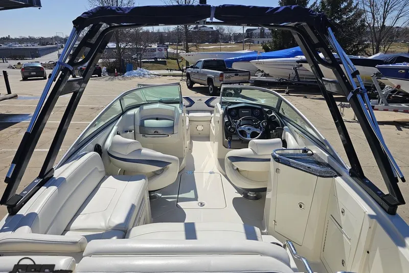 Slide: The Image of 2013 Monterey M3 Sport Boat interior with white seating and sleek dashboard. - 37