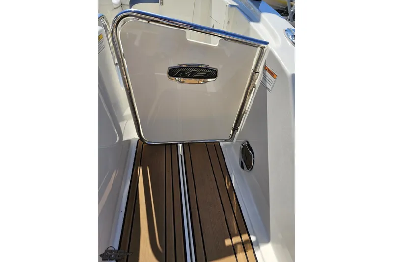 Slide: The Image of 2013 Monterey M3 Sport Boat with open door and teak flooring. - 40