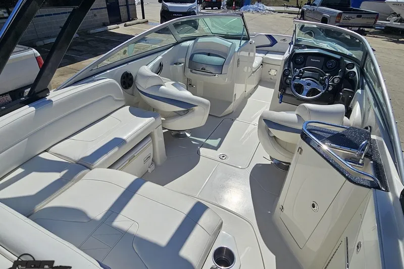 Slide: The Image of 2013 Monterey M3 Sport Boat interior with white seating and modern dashboard. - 43