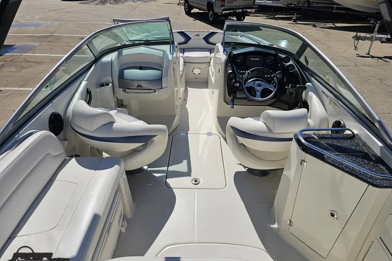 Slide: The Image of 2013 Monterey M3 Sport Boat interior with white seating and sleek dashboard design. - 45