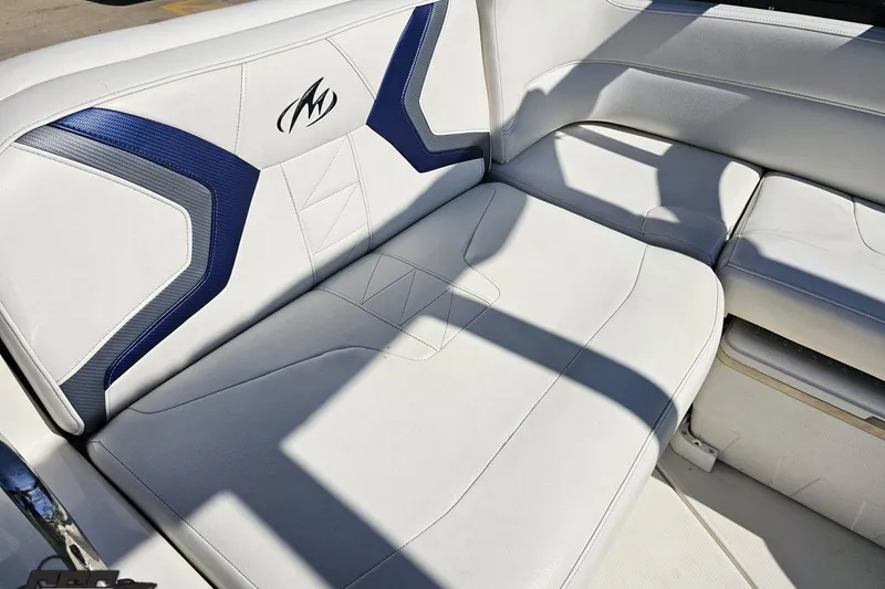 Slide: The Image of White and blue seating on 2013 Monterey M3 Sport Boat, showcasing sleek design and comfort. - 48