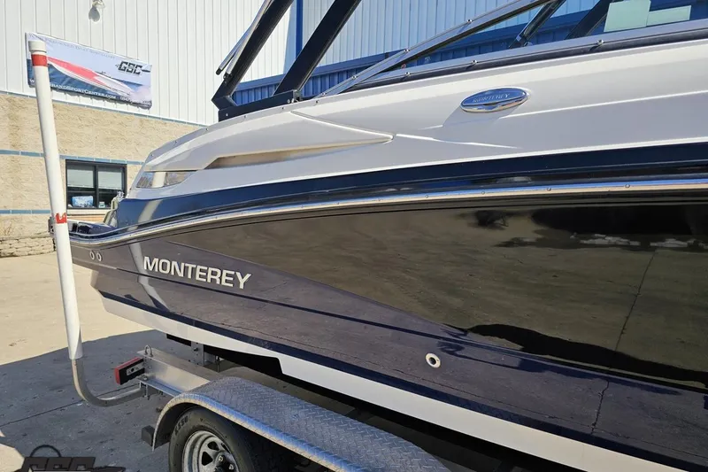 Slide: The Image of 2013 Monterey M3 Sport Boat on trailer, side view, outdoors. - 5