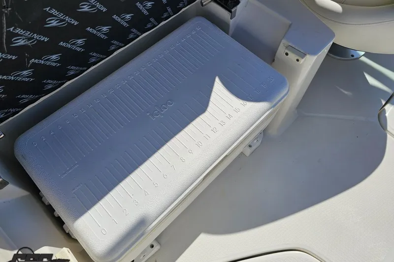 Slide: The Image of 2013 Monterey M3 Sport Boat interior with Igloo cooler and branded upholstery. - 50