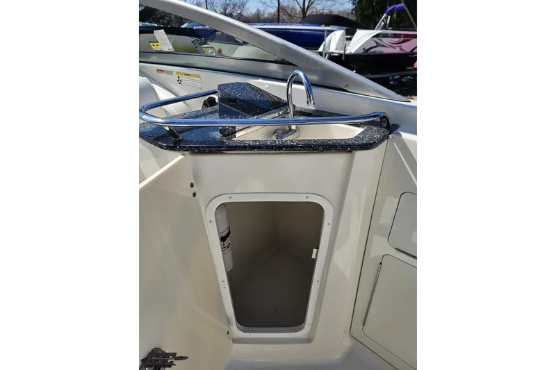 Slide: The Image of 2013 Monterey M3 Sport Boat interior with sink and storage compartment. - 53
