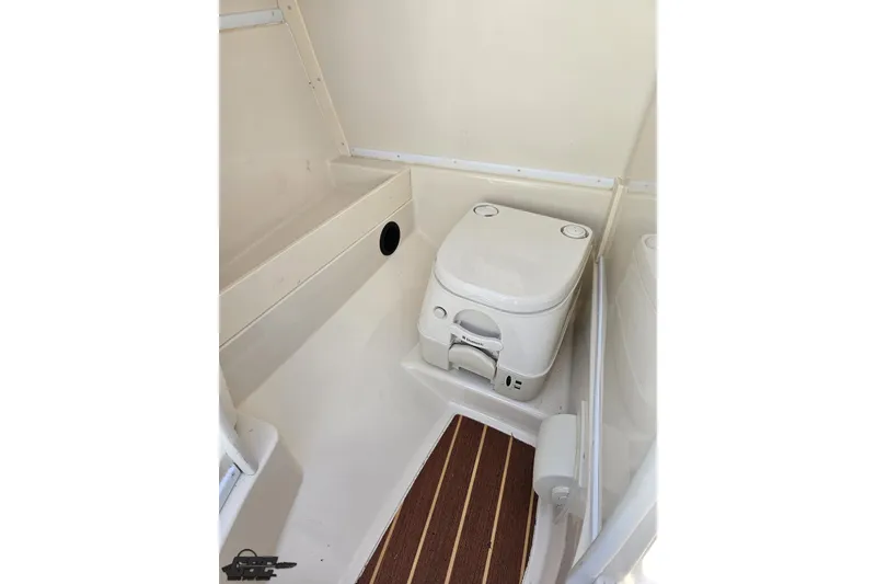 Slide: The Image of Compact bathroom in 2013 Monterey M3 Sport Boat with portable toilet. - 58