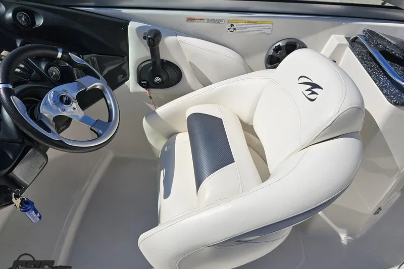Slide: The Image of Interior of a 2013 Monterey M3 Sport Boat featuring steering wheel and captain's seat. - 59