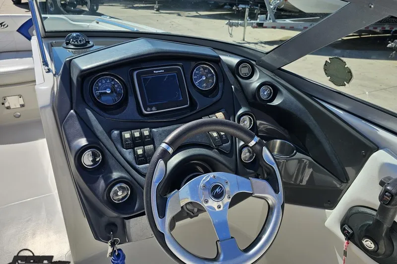 Slide: The Image of 2013 Monterey M3 Sport Boat dashboard with steering wheel and control panel. - 61