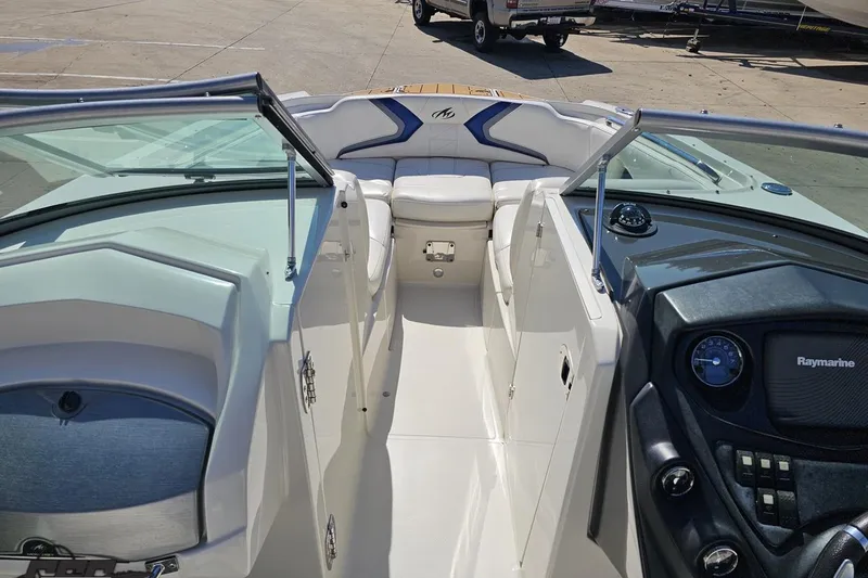 Slide: The Image of 2013 Monterey M3 Sport Boat interior with seating and dashboard view. - 63