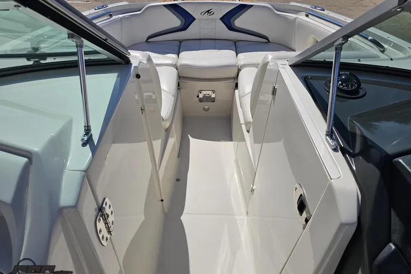 Slide: The Image of 2013 Monterey M3 Sport Boat interior with white seating and sleek design. - 64