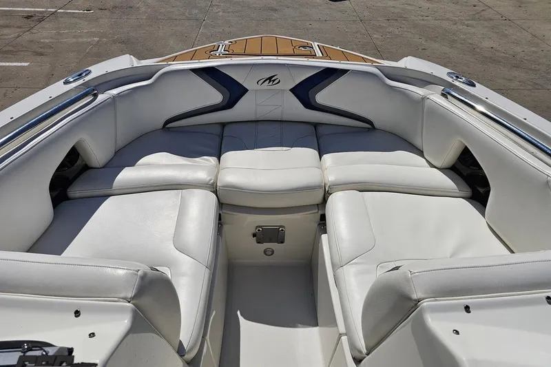 Slide: The Image of 2013 Monterey M3 Sport Boat interior with white leather seating and sleek design. - 69