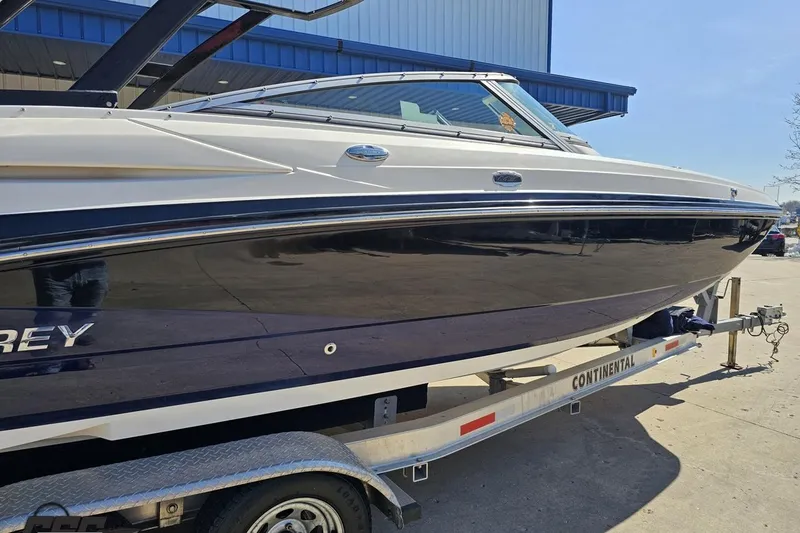 Slide: The Image of 2013 Monterey M3 Sport Boat on trailer, parked outdoors. - 7