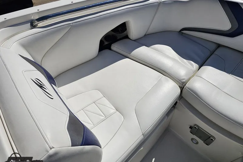 Slide: The Image of 2013 Monterey M3 Sport Boat interior with white leather seating and blue accents. - 72