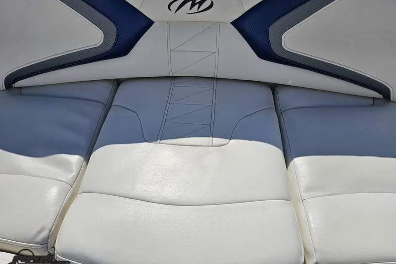 Slide: The Image of 2013 Monterey M3 Sport Boat interior seating with white and blue upholstery. - 74