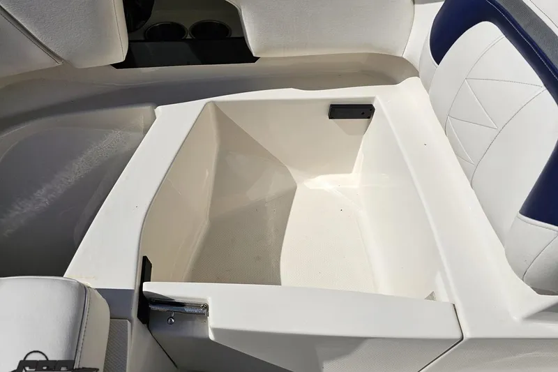 Slide: The Image of Interior storage compartment of a 2013 Monterey M3 Sport Boat, featuring white and blue seating. - 79