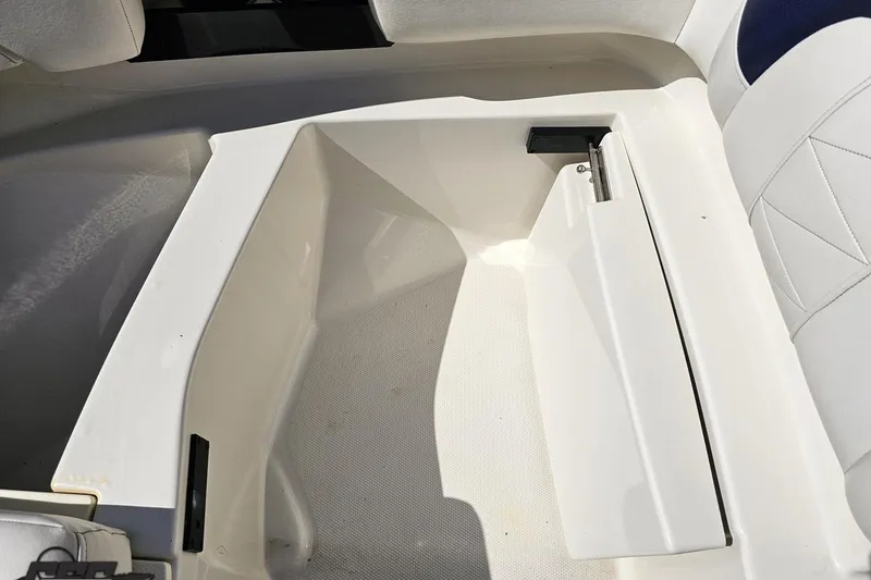 Slide: The Image of Storage compartment in a 2013 Monterey M3 Sport Boat, featuring white interior design. - 80