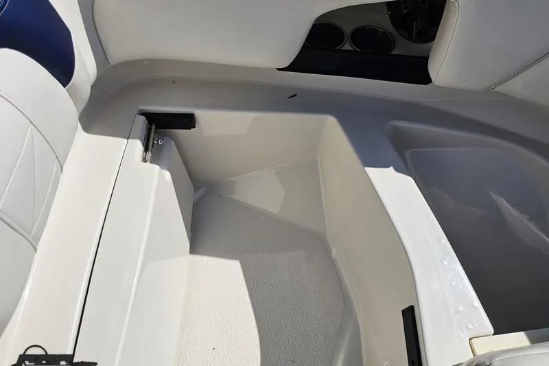 Slide: The Image of Interior view of a 2013 Monterey M3 Sport Boat, showcasing seating and storage area. - 82