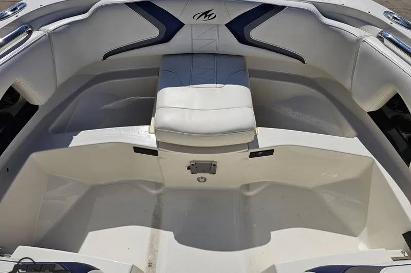 Slide: The Image of 2013 Monterey M3 Sport Boat interior with white seating and blue accents. - 83