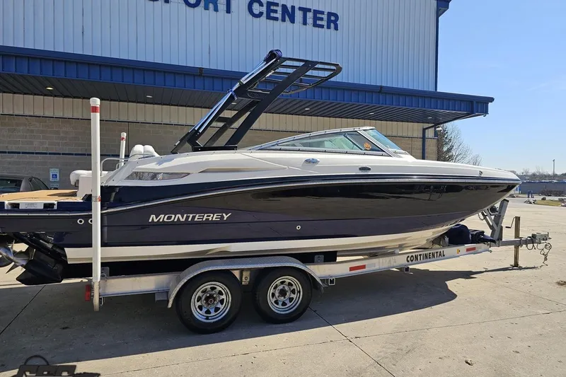 Slide: The Image of 2013 Monterey M3 Sport Boat on trailer outside a building. - 9