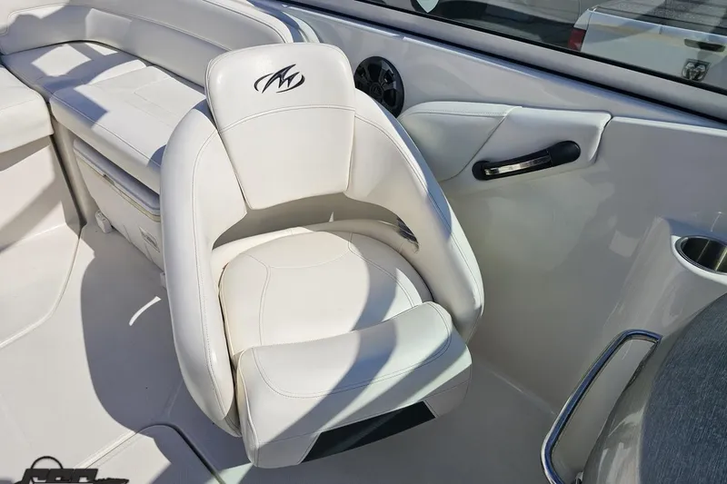 Slide: The Image of 2013 Monterey M3 Sport Boat interior with white leather seating and sleek design. - 90