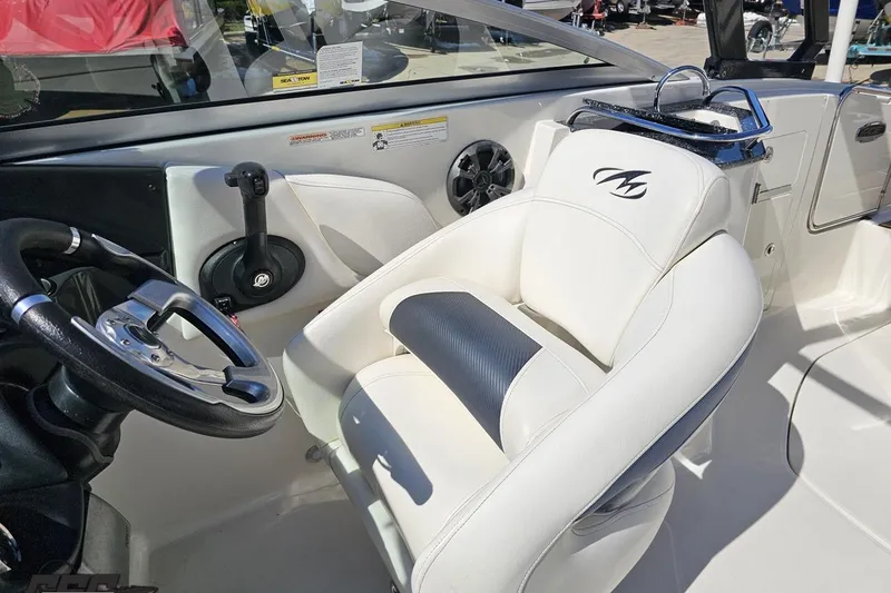 Slide: The Image of Interior of 2013 Monterey M3 Sport Boat with steering wheel and white seating. - 91