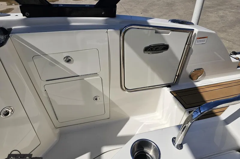 Slide: The Image of 2013 Monterey M3 Sport Boat interior with storage compartments and sleek design. - 94