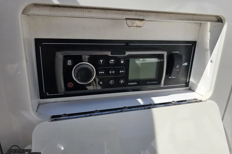 Slide: The Image of Control panel of a 2013 Monterey M3 Sport Boat featuring a Fusion MS-IP600 stereo system. - 95