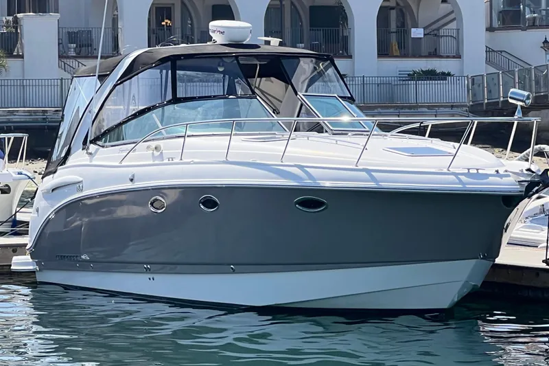 Slide: The Image of 2007 Chaparral Signature 330 boat docked at marina, featuring sleek design and modern amenities. - 1