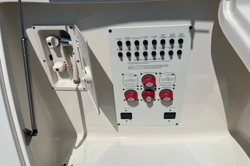 Slide: The Image of Control panel of a 2007 Chaparral Signature 330 boat, featuring switches and battery selectors. - 10