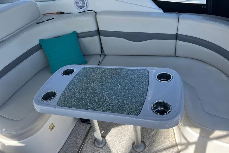 Slide: The Image of 2007 Chaparral Signature 330 boat interior with cushioned seating and table. - 12