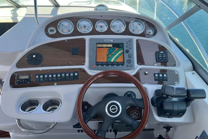 Slide: The Image of Dashboard of a 2007 Chaparral Signature 330 boat with navigation controls and gauges. - 15