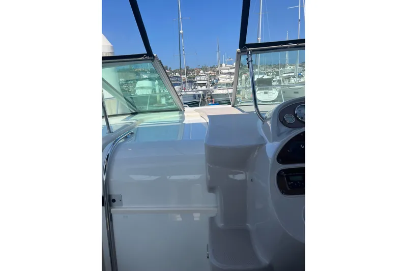 Slide: The Image of 2007 Chaparral Signature 330 boat helm with marina view in the background. - 17