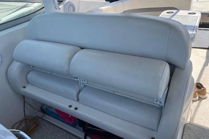 Slide: The Image of 2007 Chaparral Signature 330 boat interior with white cushioned seating. - 19