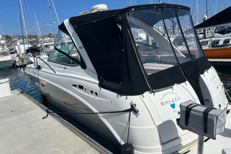 Slide: The Image of 2007 Chaparral Signature 330 yacht docked at marina under clear sky. - 2