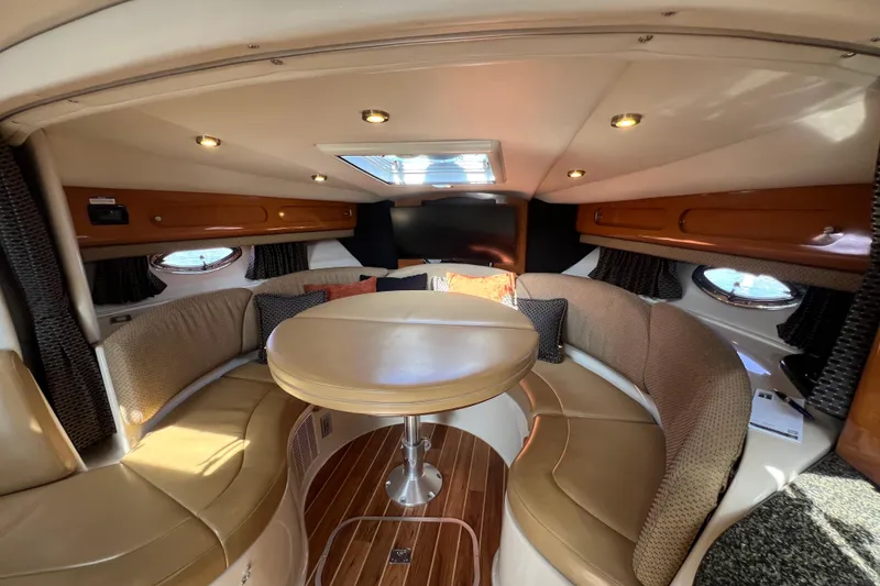 Slide: The Image of Luxurious 2007 Chaparral Signature 330 yacht interior with elegant seating and wooden flooring. - 22