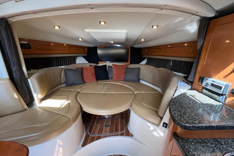 Slide: The Image of Luxurious interior of 2007 Chaparral Signature 330 yacht with plush seating and modern amenities. - 23