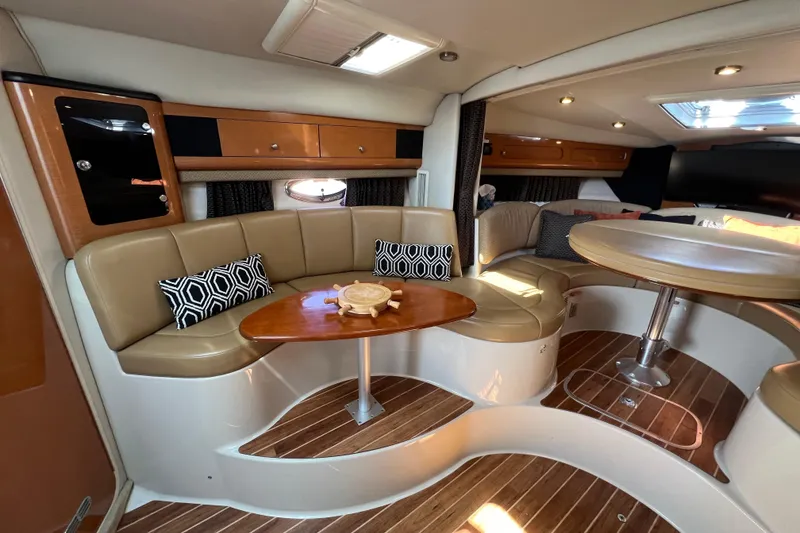 Slide: The Image of Luxurious 2007 Chaparral Signature 330 yacht interior with elegant seating and wooden accents. - 24