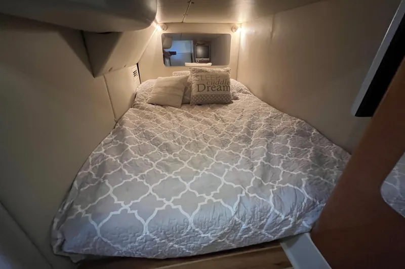 Slide: The Image of Cozy cabin bed in 2007 Chaparral Signature 330 boat with decorative pillows. - 30