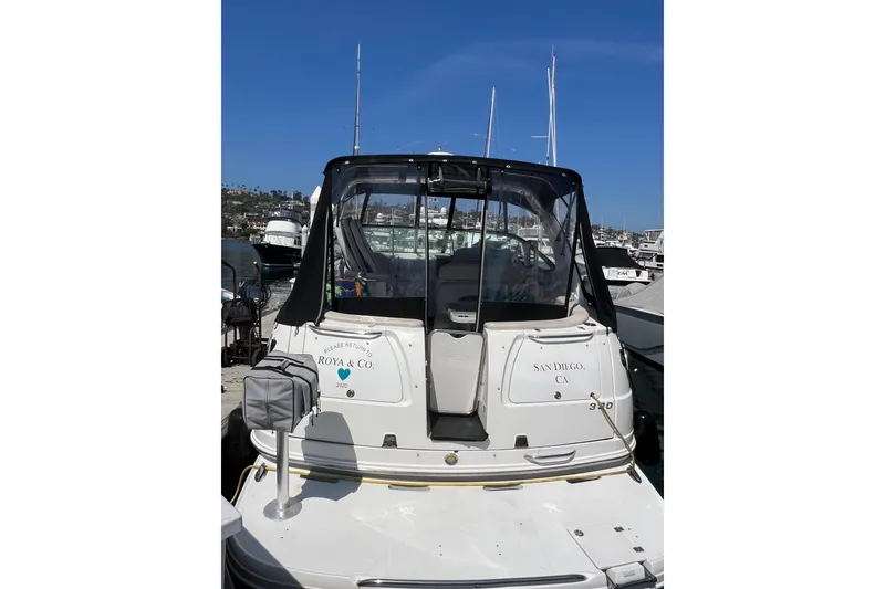 Slide: The Image of 2007 Chaparral Signature 330 boat docked in San Diego marina under clear blue sky. - 4