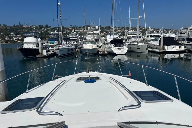 Slide: The Image of 2007 Chaparral Signature 330 yacht docked in a marina with other boats. - 6